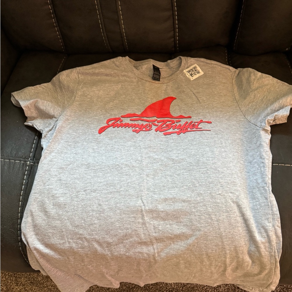 Brand new! Jimmy Buffet t-shirt says size L but fits more like a medium